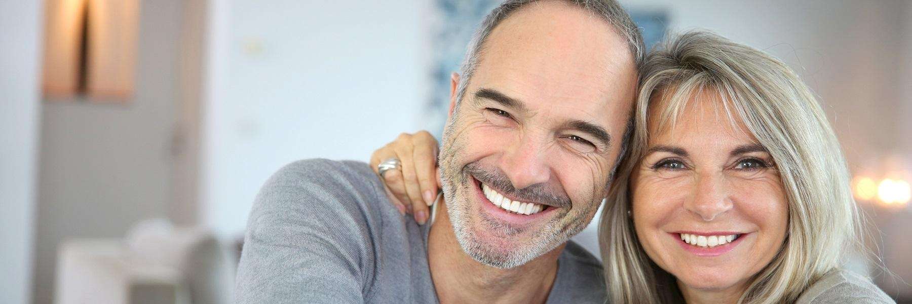 older couple with dental implants in raleigh nc