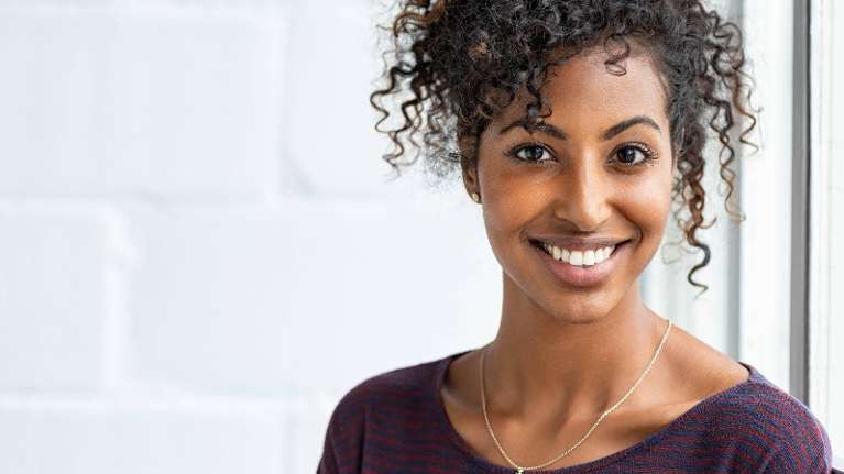 woman with a bright white smile in raleigh nc