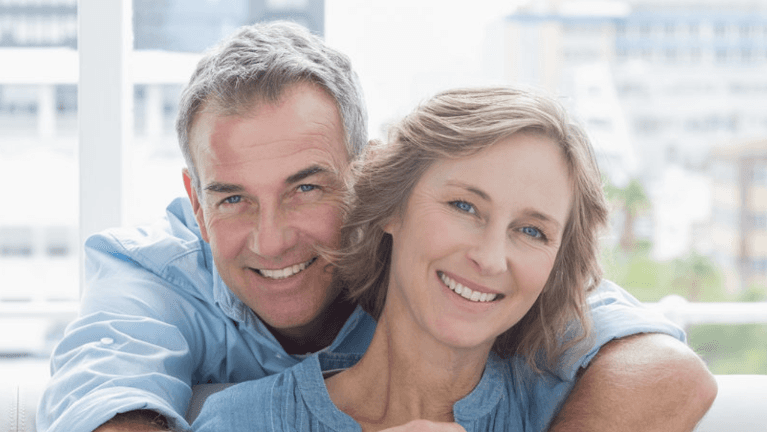 older couple smiling and hugging in raleigh 