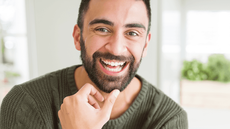 middle-aged man after cosmetic dentistry appointment in raleigh nc